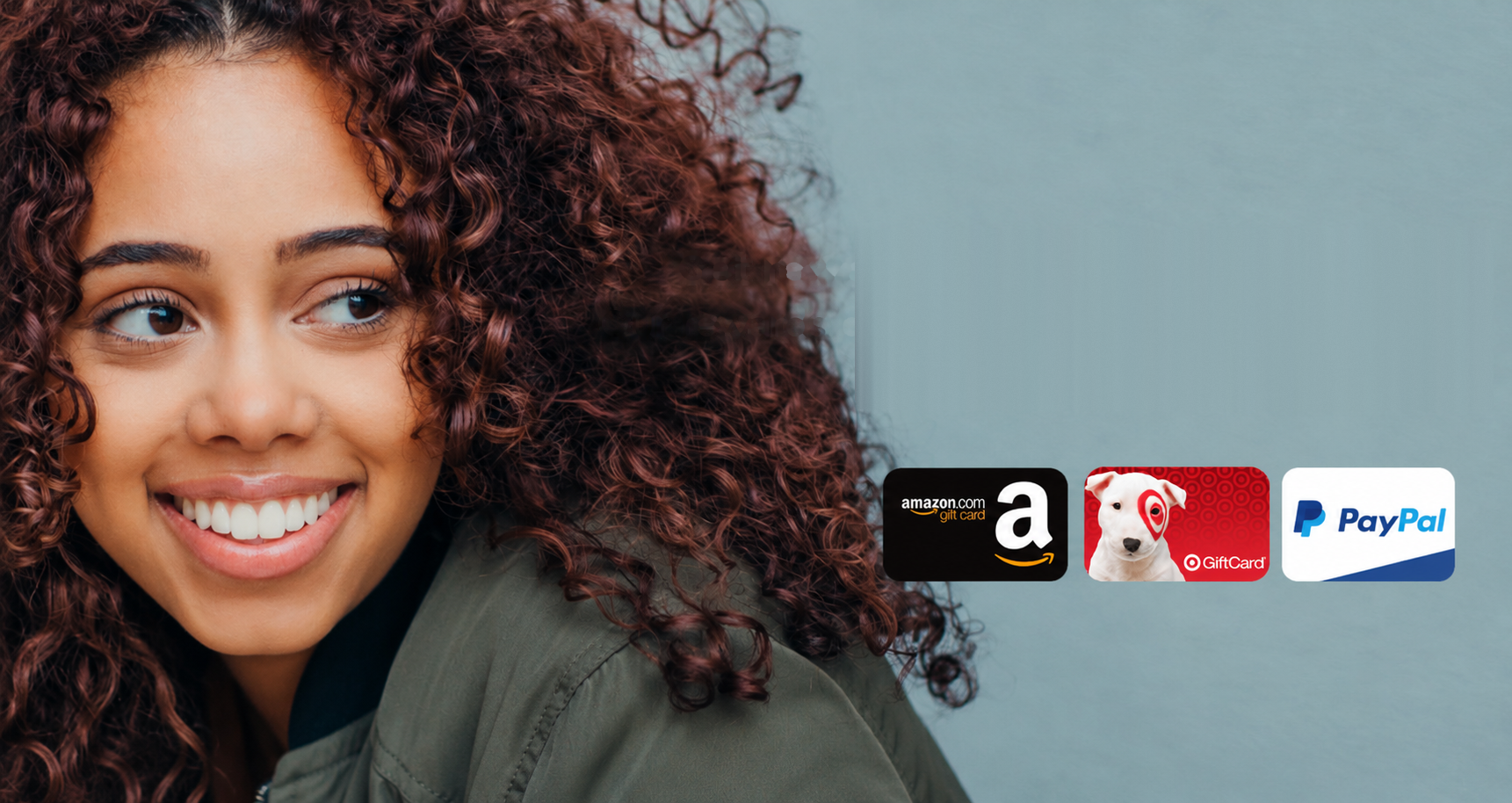 Smiling woman next to text reading: Get rewarded for your participation. Our rewards program offers popular gift cards and cashouts via PayPal, with Amazon, Target, and PayPal cards shown